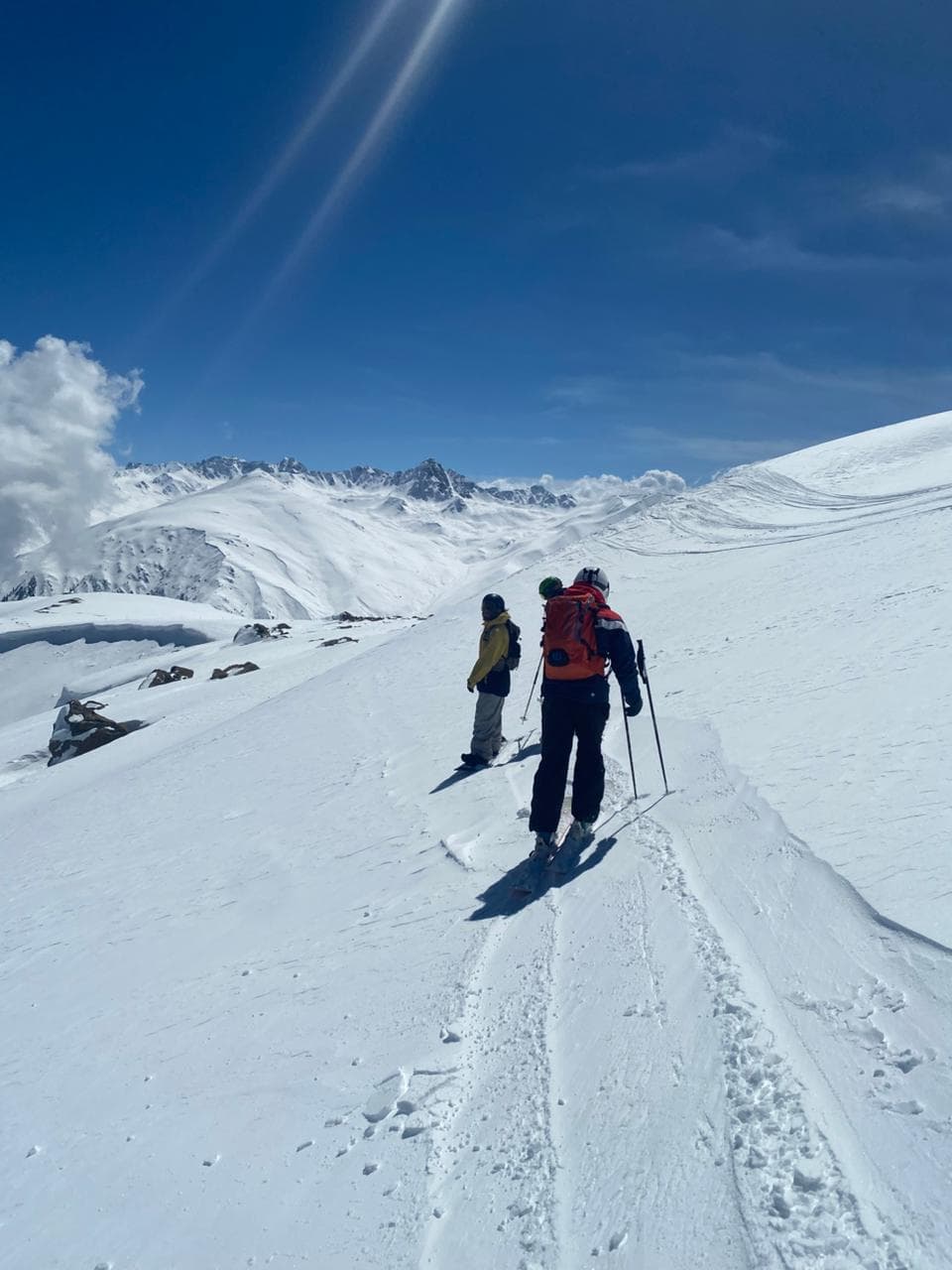 Skier descending a snowy slope in Gulmarg